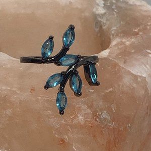 Blue crystals on Black setting size 9